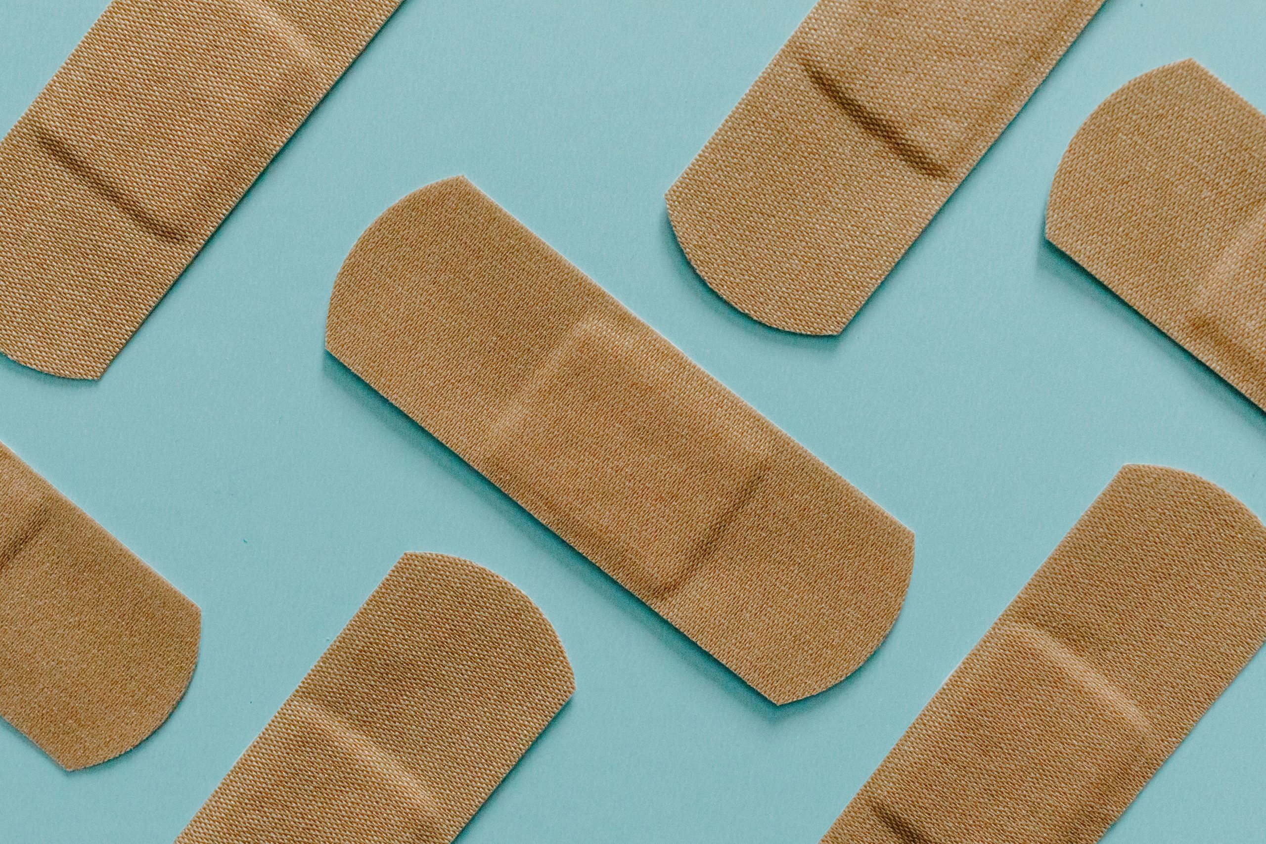 Band-Aids arranged on a blue background representing the lesson on fairness and differentiation in the classroom